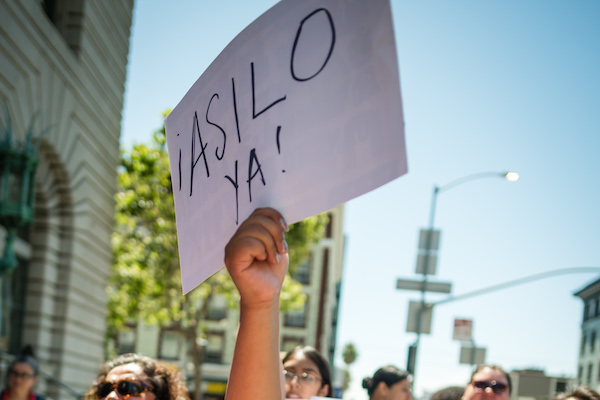 Protest sign reading ¡Asilo ya!